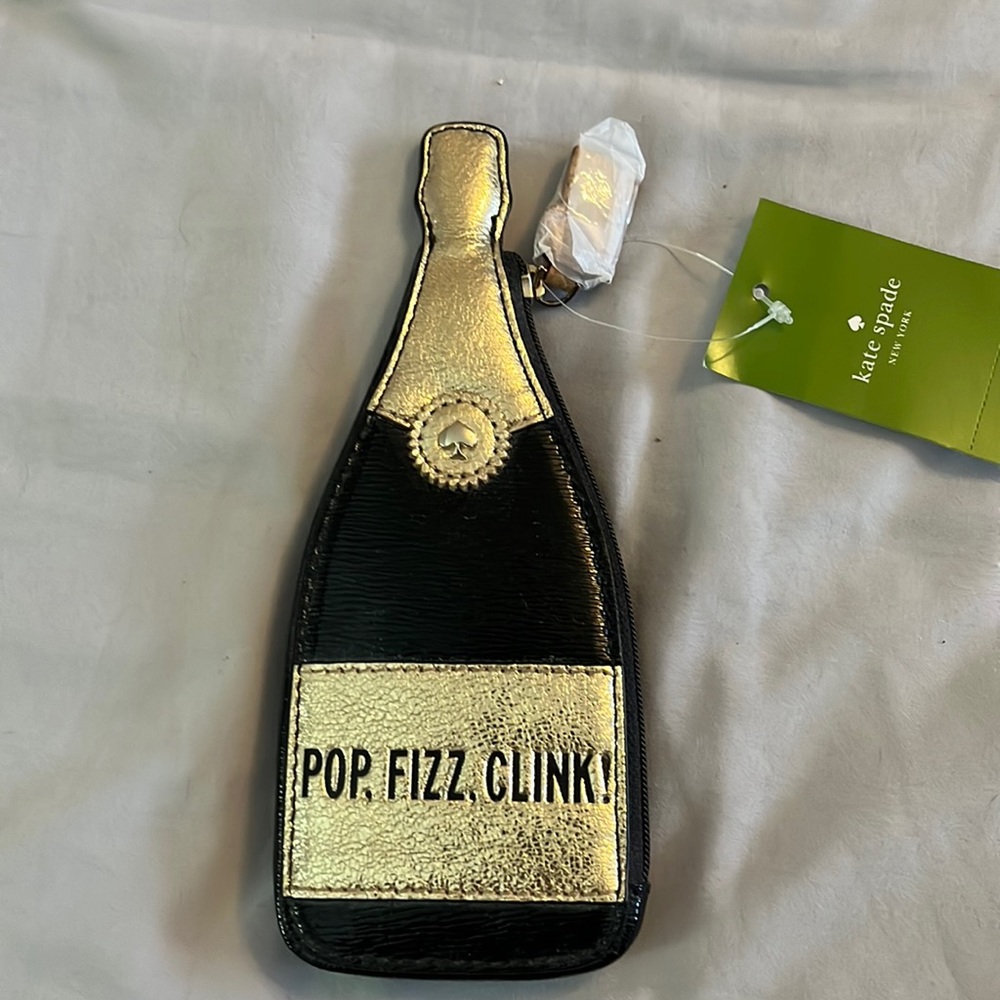 Champagne coin purse with cork zipper pull.